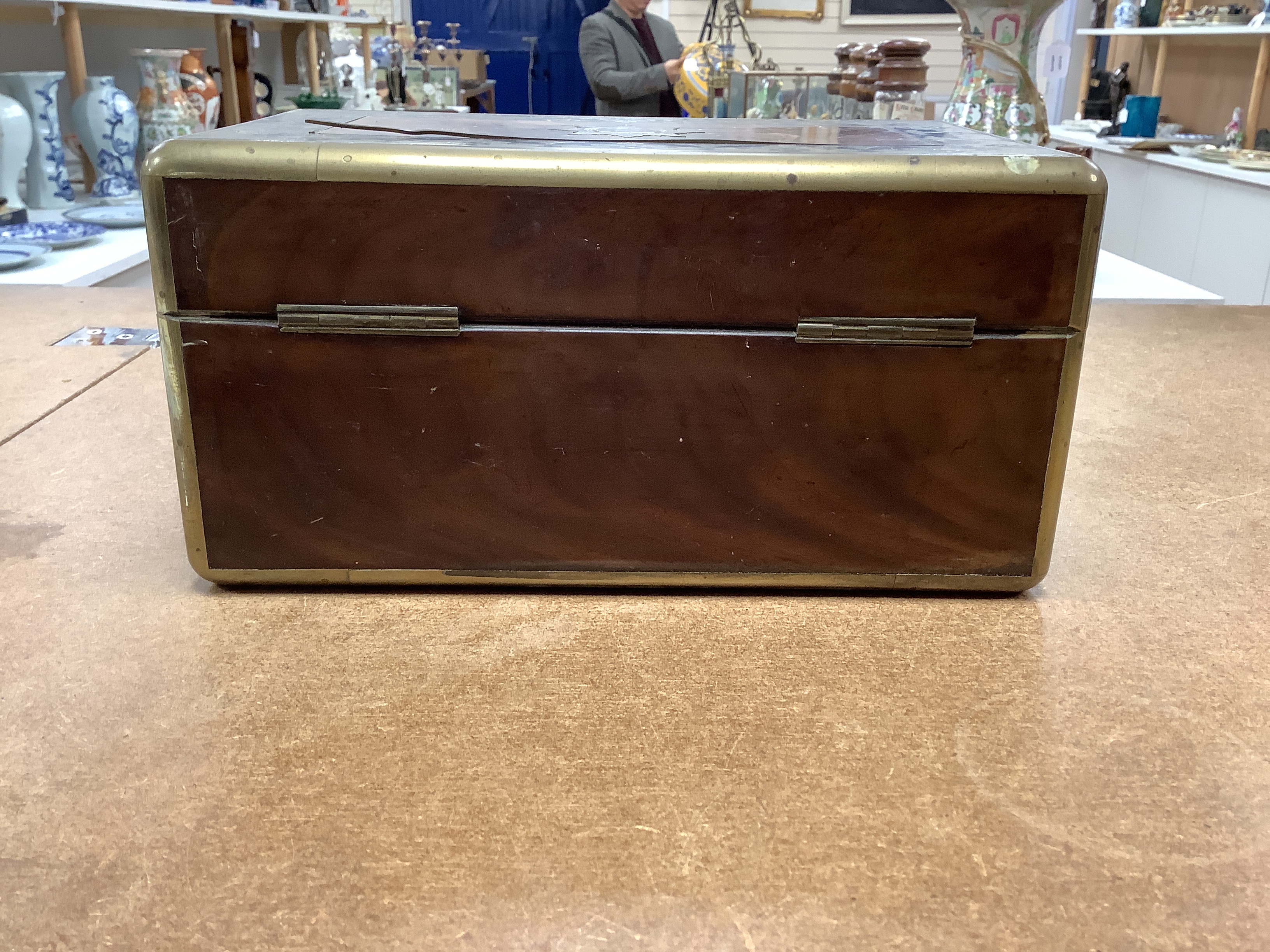 A William IV Cut brass, mahogany and ebony travelling vanity box, with silver-capped bottles, 24.5cm wide